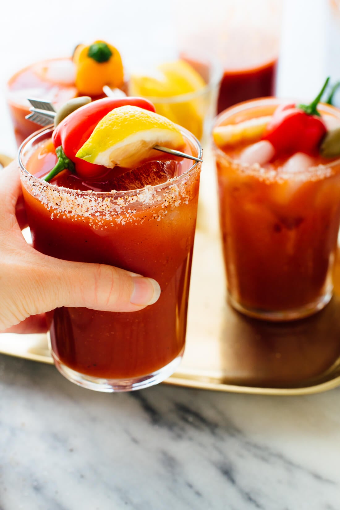hand holding bloody mary cocktail