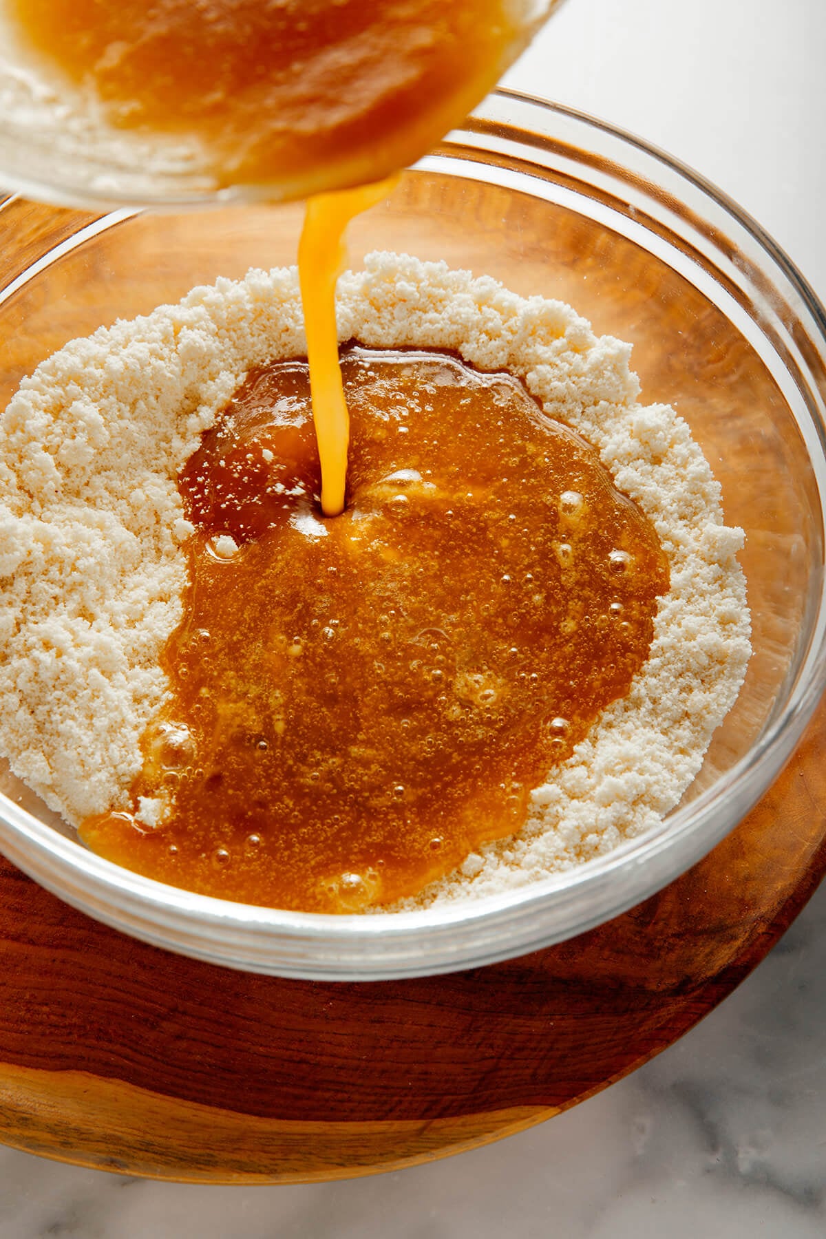 pouring wet mixture into dry